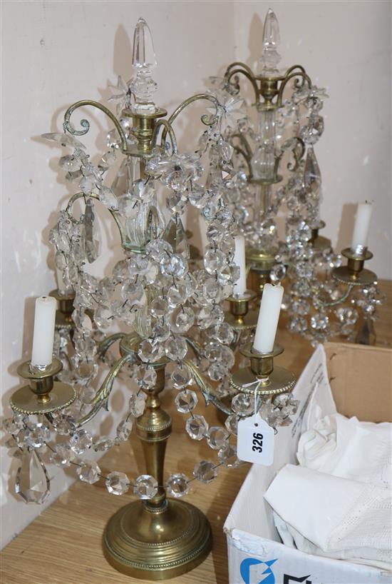 A pair of late 19th century Bohemian brass and lustre hung four branch candelabra, height 60cm (break to stem of one)